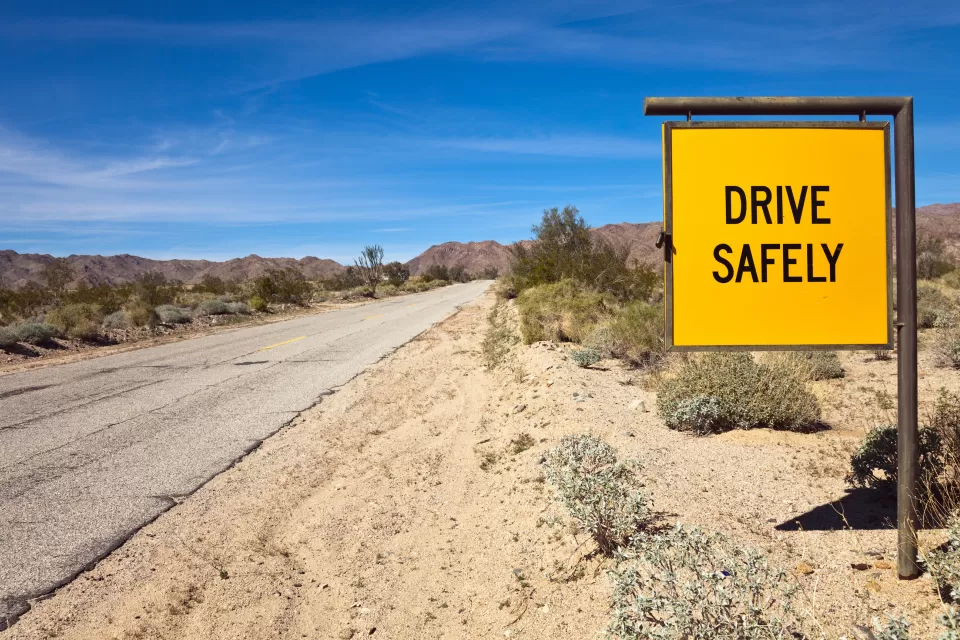 Yellow Drive Safely on desert road